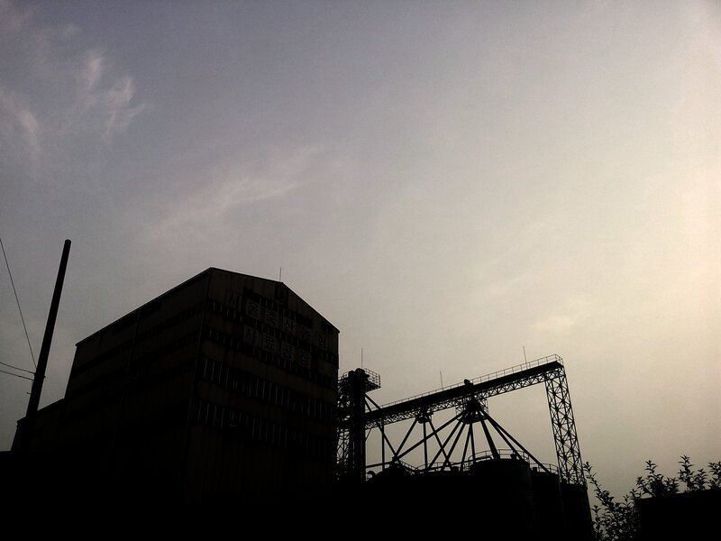 silhouette of industrial complex