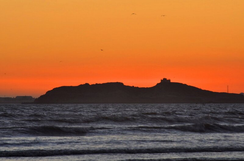 Silhouette of Island at Sunset — Orange, Dramatic