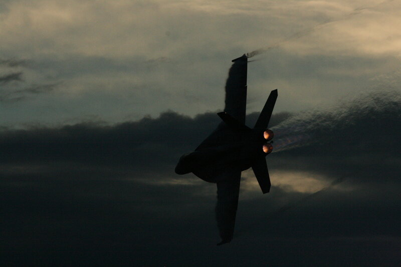 Silhouette of jet in flight