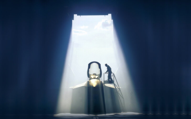 Silhouette of jet in hangar