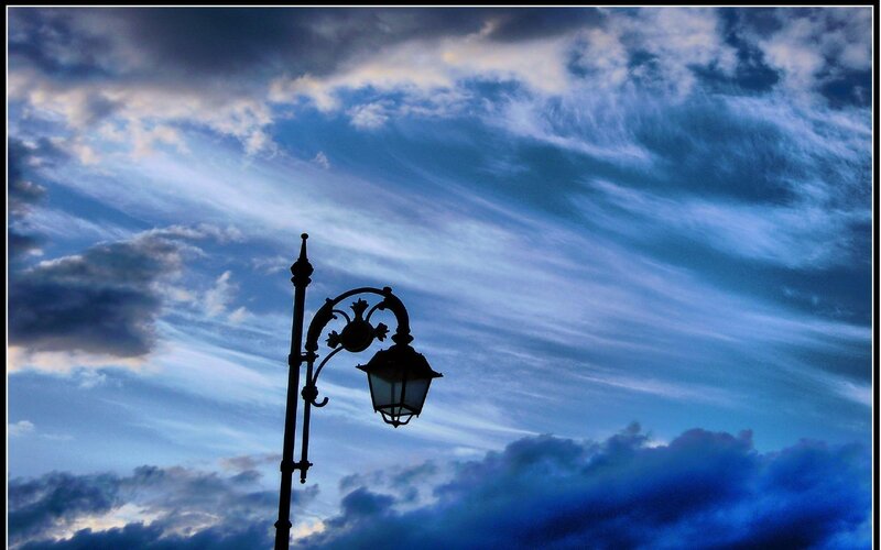 silhouette of lamp post against sky