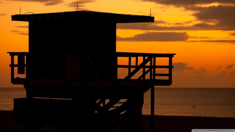 silhouette of lifeguard tower at sunset