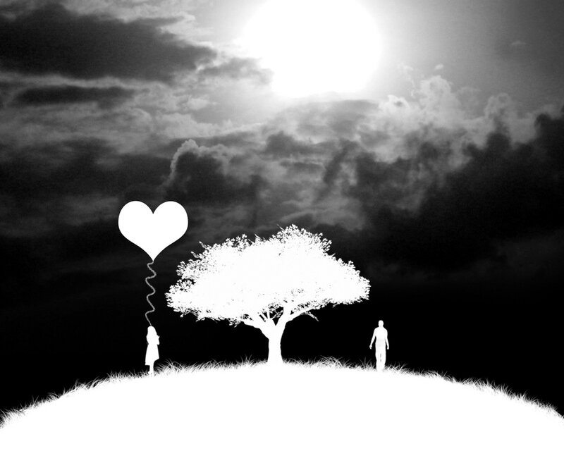 Silhouette of lovers with heart balloon