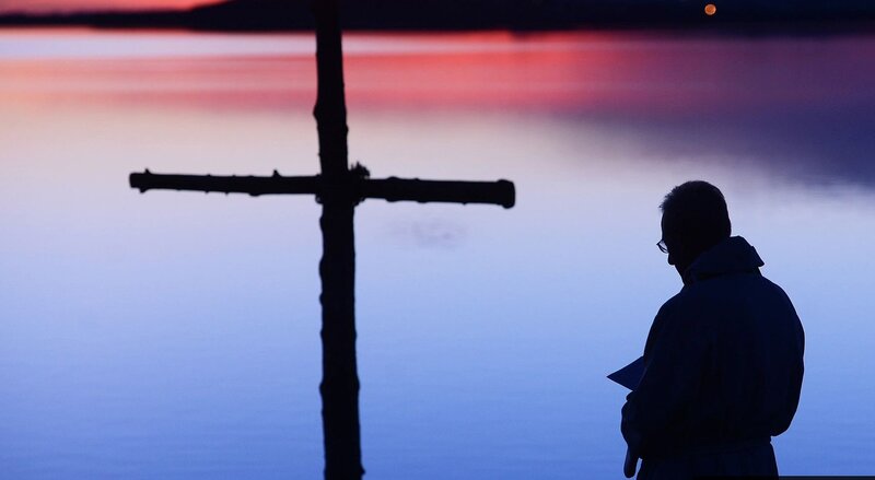 Silhouette of Man at Cross