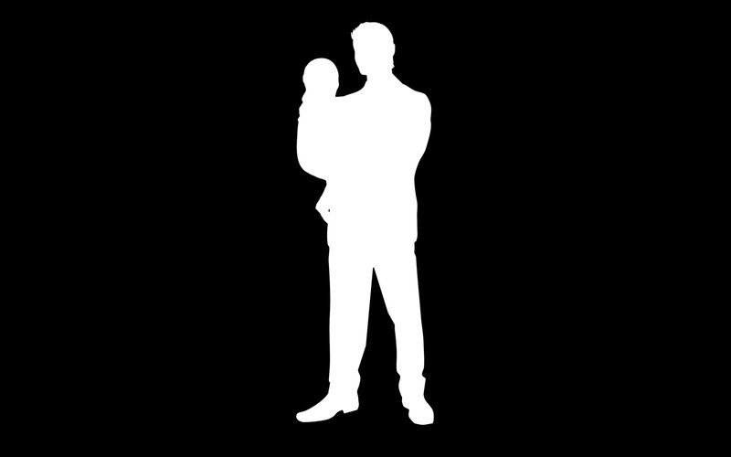 silhouette of man holding child