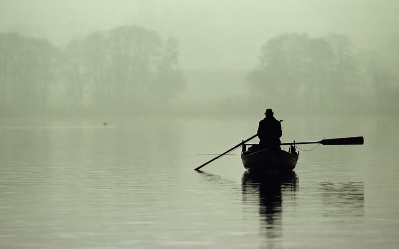 Silhouette of Man in Boat