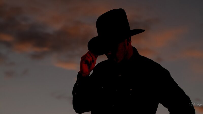 Silhouette of Man in Hat — Black, Dramatic, Sunset