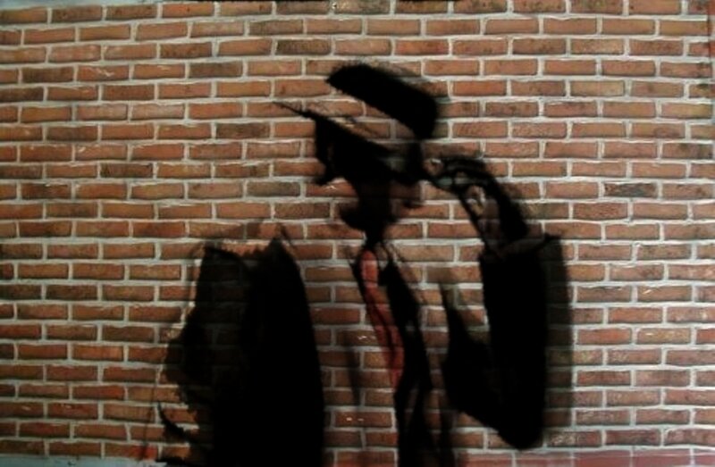 Silhouette of Man in Hat — Black