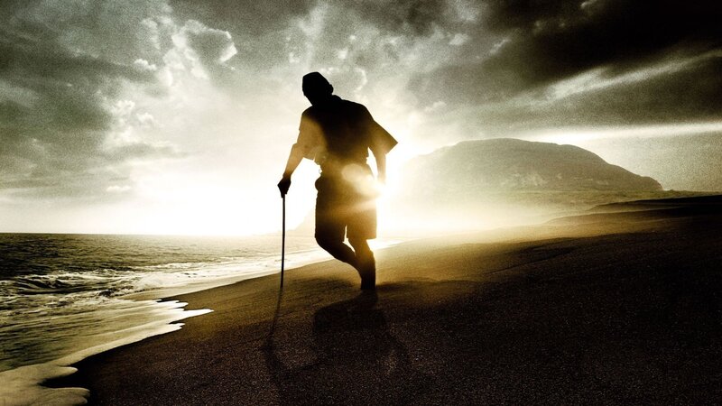 silhouette of man on beach