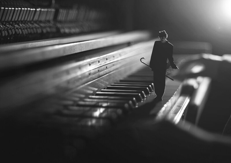 Silhouette of Man on Piano