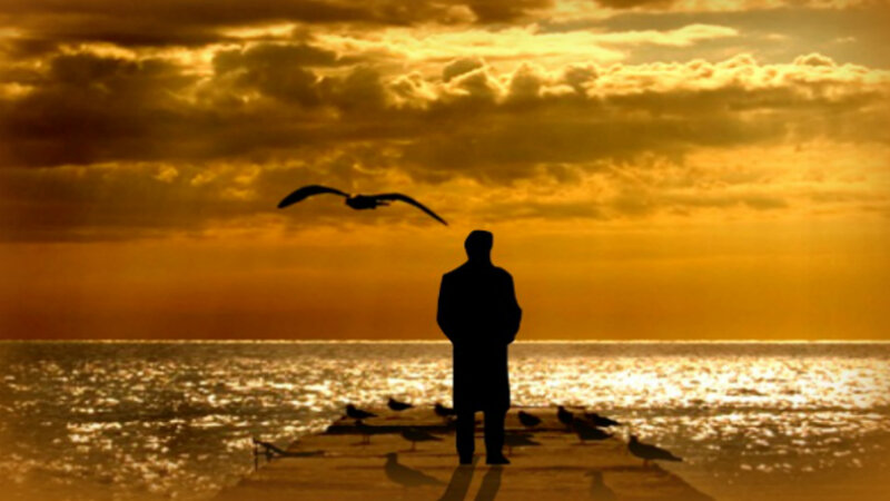 Silhouette of Man on Pier