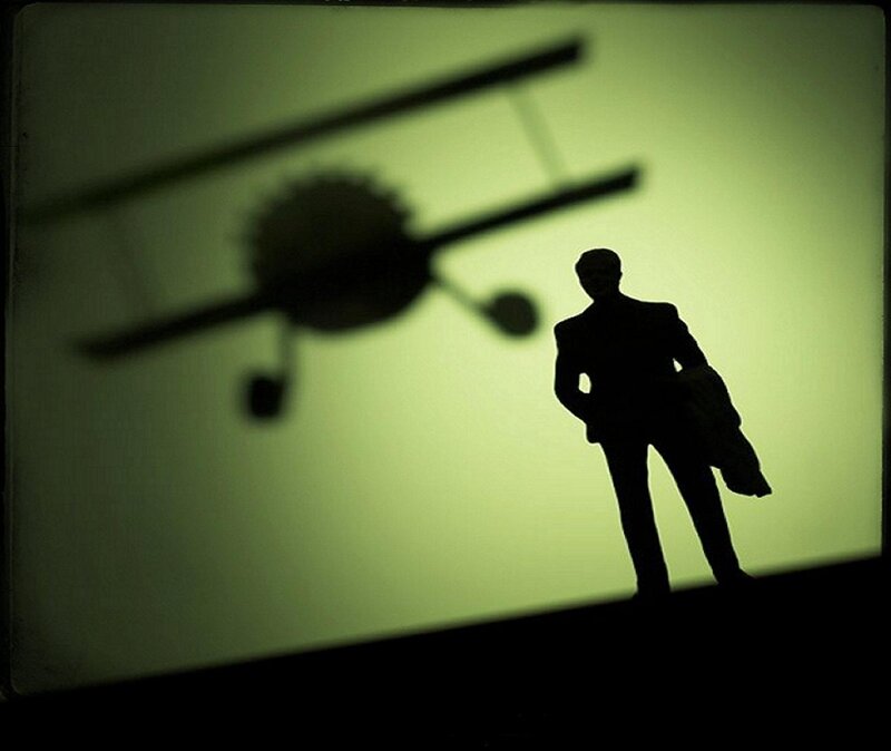 Silhouette of Man with Airplane