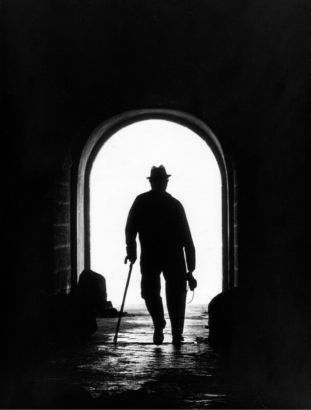 silhouette of man with cane