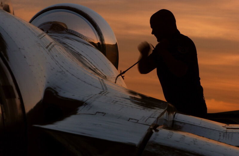 Silhouette of mechanic at sunset