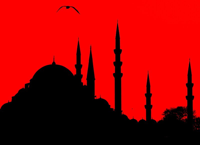 Silhouette of mosque at sunset
