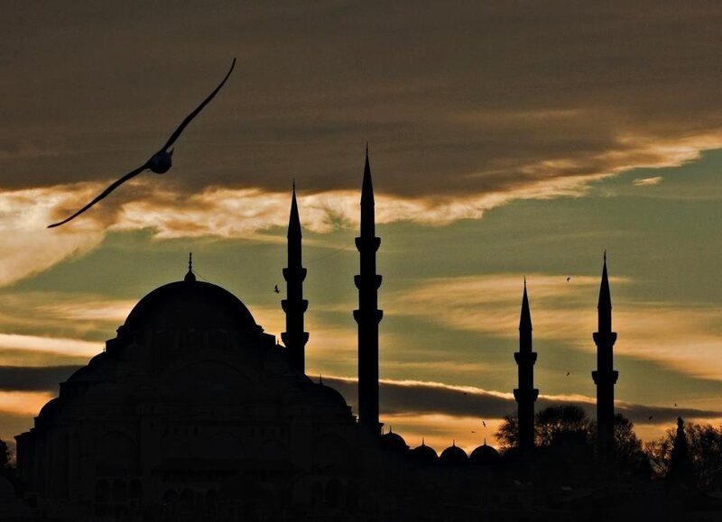 Silhouette of mosque at sunset