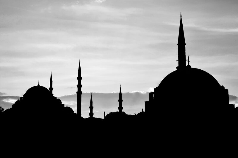 Silhouette of mosques at dusk