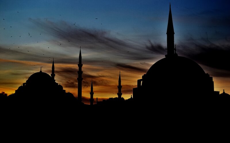 Silhouette of mosques at sunset