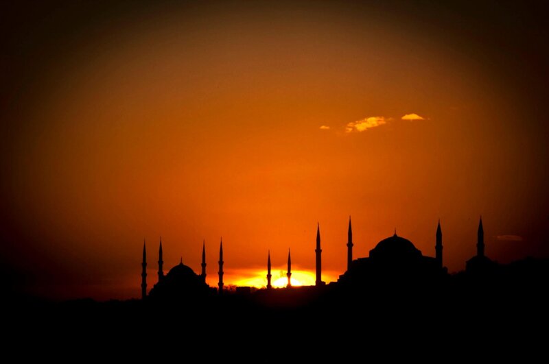 Silhouette of mosques at sunset