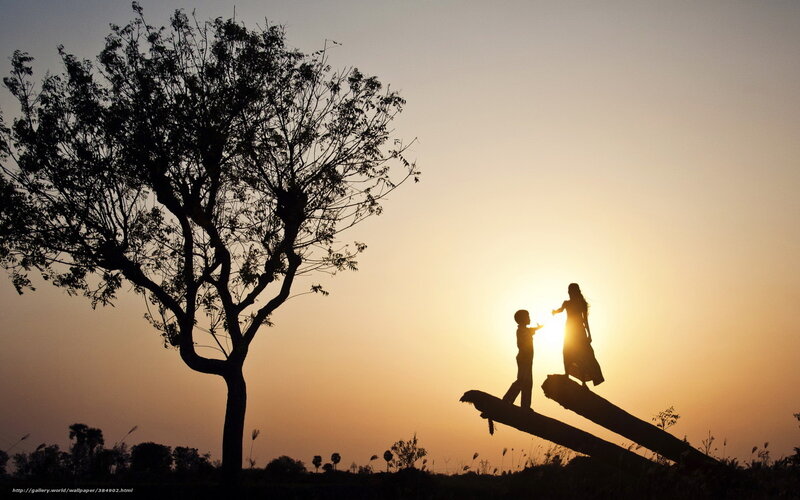 Silhouette of Mother and Child at Sunset
