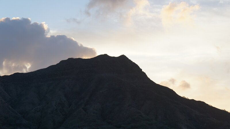 silhouette of mountain at sunset