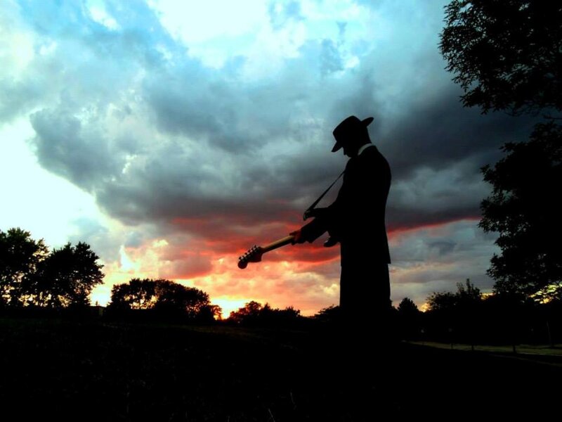 Silhouette of Musician — Orange, Dramatic