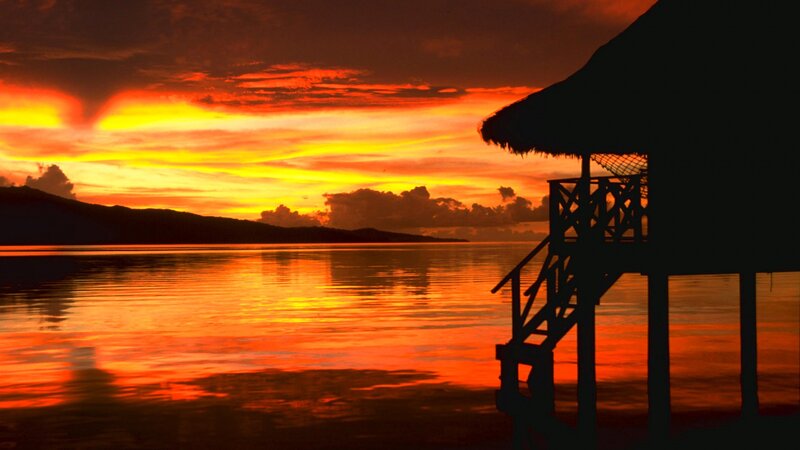 Silhouette of Overwater Bungalow — Orange, Dramatic