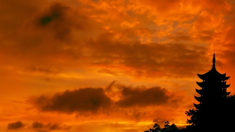 Silhouette of pagoda at sunset