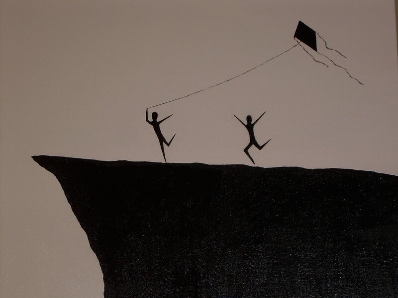 silhouette of people flying a kite