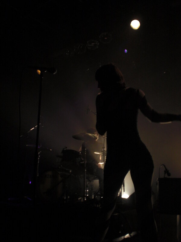 silhouette of performer on stage