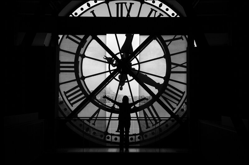 Silhouette of Person at Clock