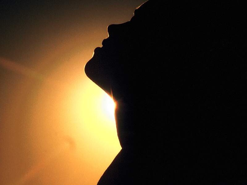 silhouette of person at sunset