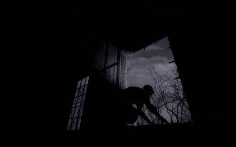 silhouette of person at window