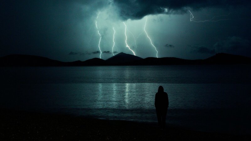 Silhouette of Person — Black, Dramatic, Night, Photograph, Lightning