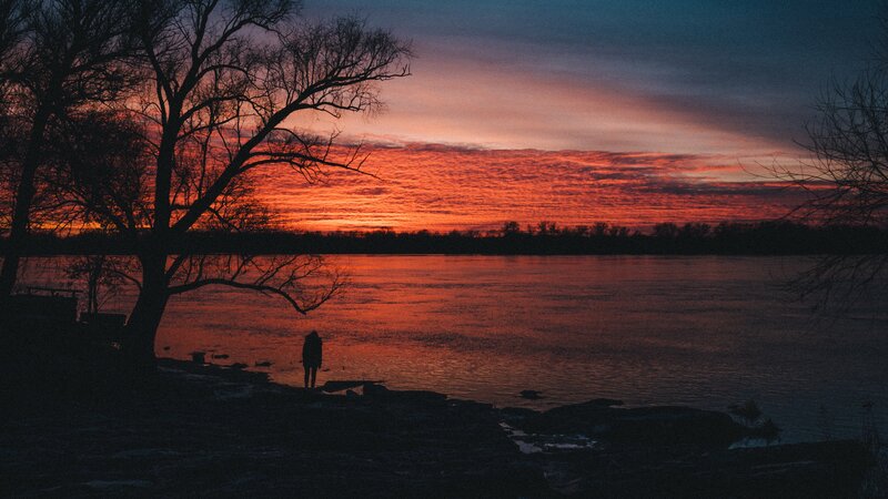 Silhouette of Person by River