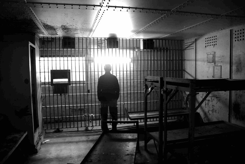 Silhouette of Person in Cell