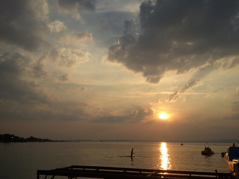 Silhouette of Person in Water — Orange, Serene, Sunset
