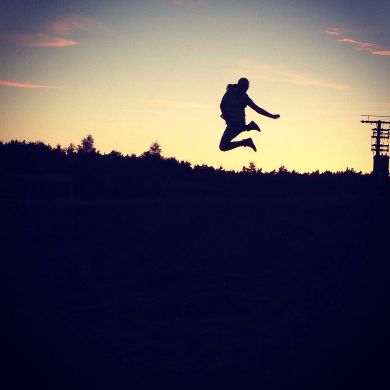 Silhouette of Person Jumping — Blue, Dramatic, Sunset