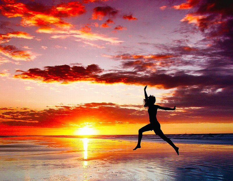 Silhouette of Person Jumping — Orange, Dramatic, Sunset
