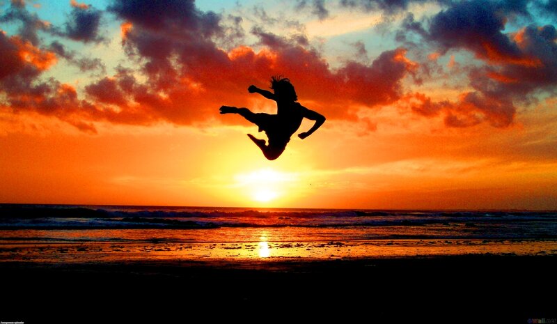 Silhouette of Person Jumping — Orange, Dramatic
