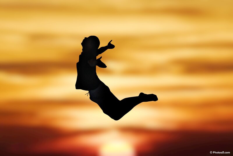 Silhouette of Person Jumping — Orange