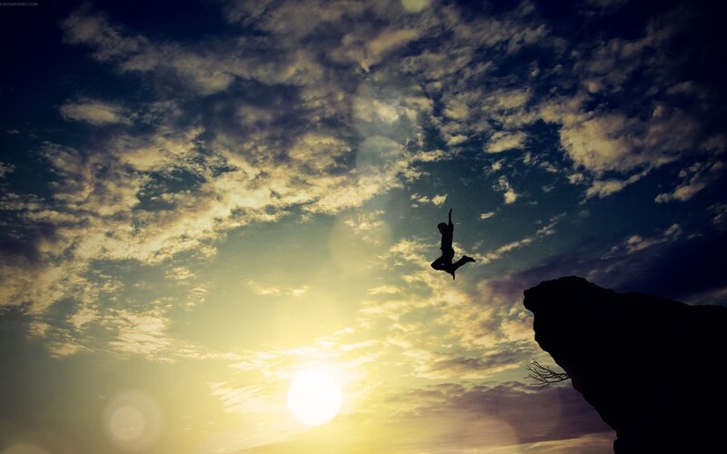 Silhouette of Person Jumping — Yellow, Dramatic, Sunset, Photograph