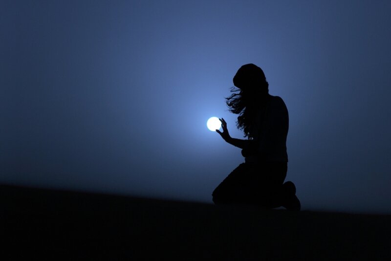 Silhouette of Person Kneeling — Blue, Dramatic