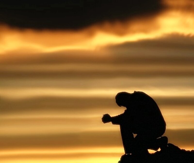 Silhouette of Person Kneeling — Orange, Dramatic