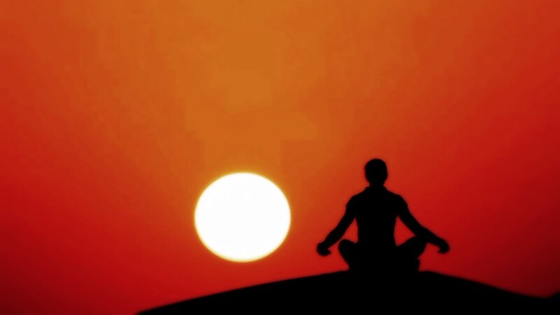 Silhouette of Person Meditating — Red