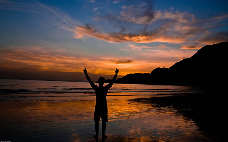 Silhouette of Person on Beach — Orange, Dramatic, Sunset, Photograph, Ocean, Mountain