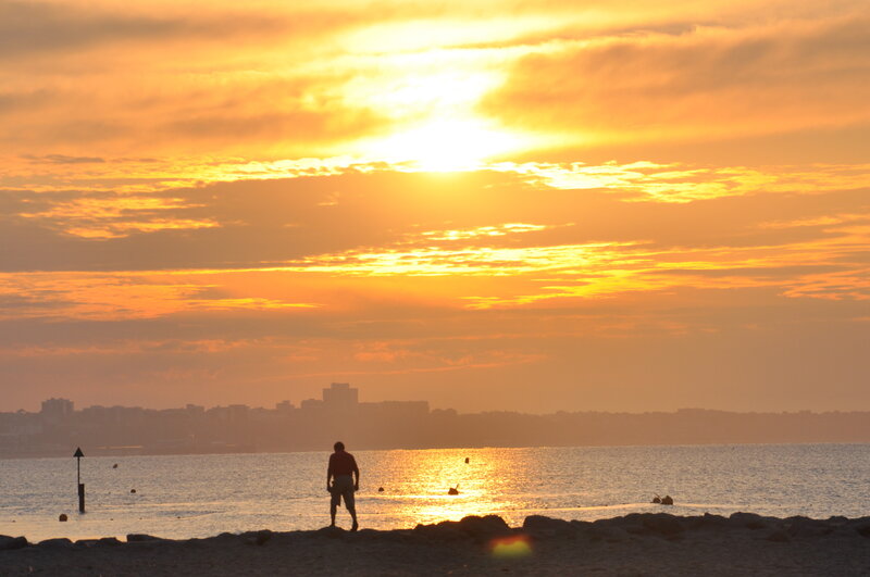 Silhouette of Person on Beach — Orange, Serene, Sunset