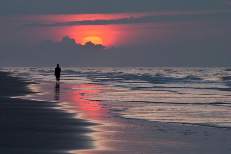 Silhouette of Person on Beach — Red, Serene, Sunset