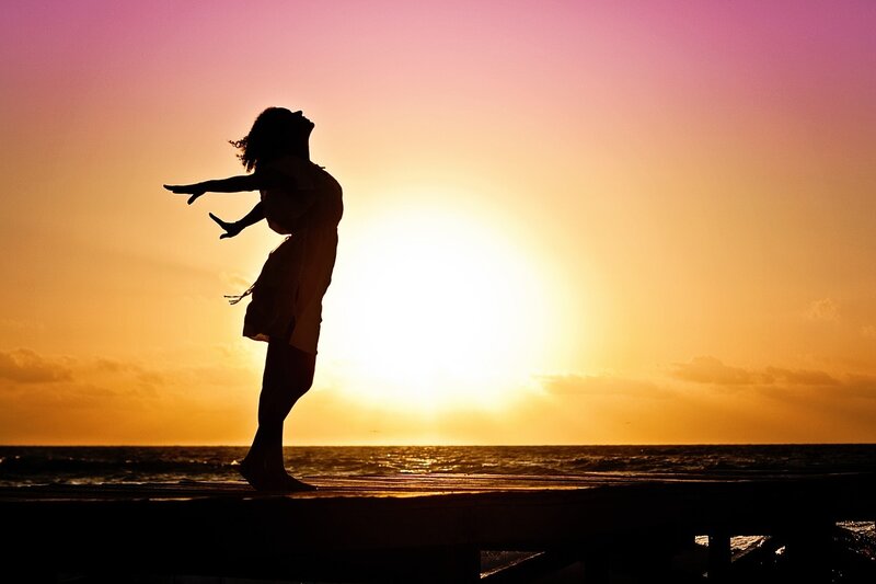 Silhouette of Person on Pier — Orange, Serene