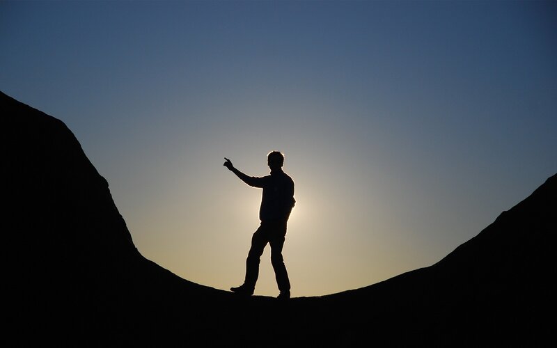 Silhouette of Person on Ridge